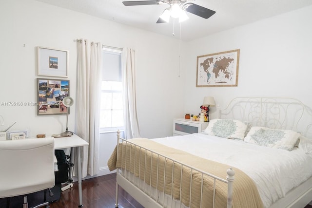 bedroom with baseboards, a ceiling fan, and dark wood-style flooring