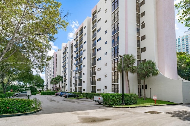 view of property with uncovered parking