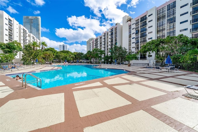 pool featuring a patio and a city view