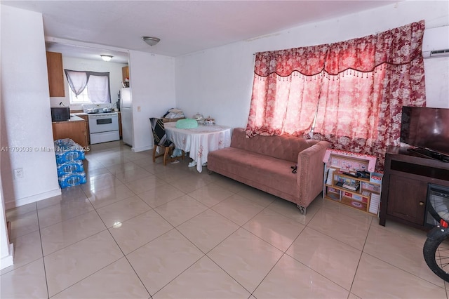 living room with light tile patterned floors and a wall mounted air conditioner