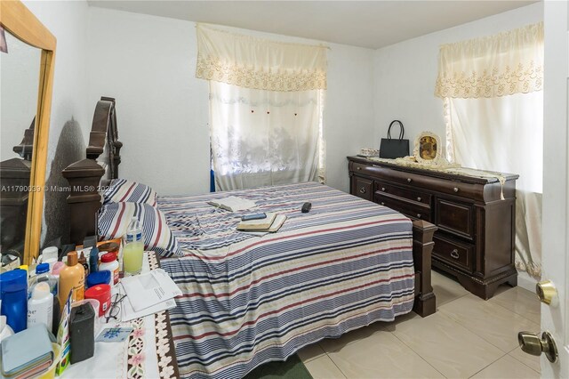 bedroom featuring tile patterned flooring