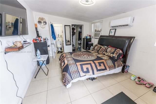 bedroom with tile patterned flooring, baseboards, lofted ceiling, and a wall mounted AC