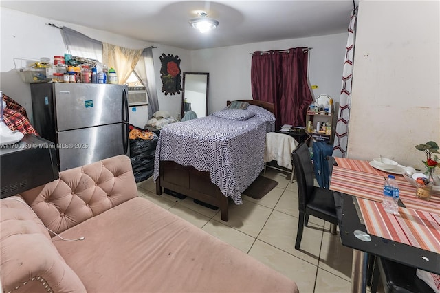 tiled bedroom with freestanding refrigerator