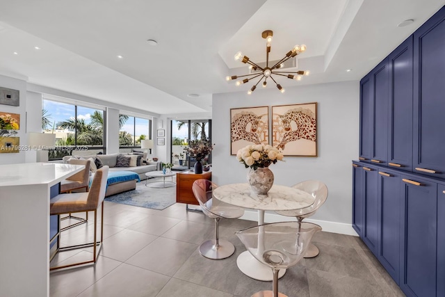dining area with light tile patterned floors, recessed lighting, and a chandelier
