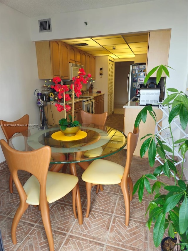 dining space featuring visible vents