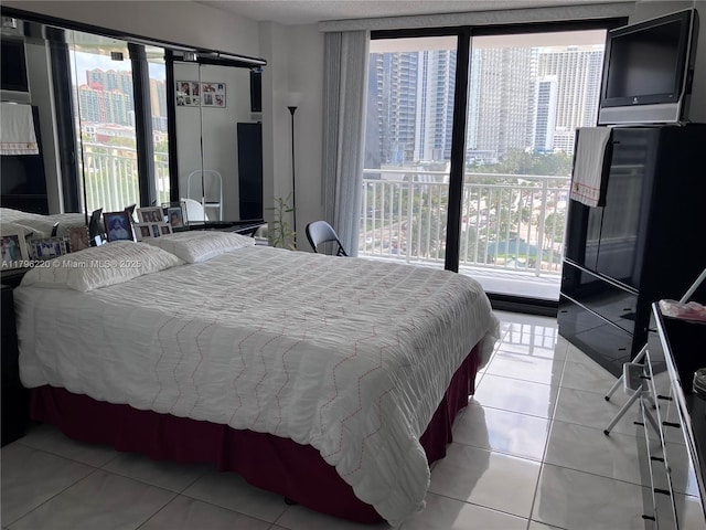 bedroom with light tile patterned floors
