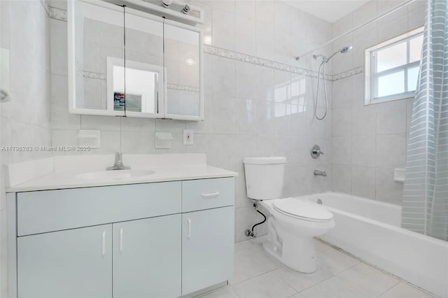 full bathroom with tile walls, tile patterned flooring, shower / tub combo, vanity, and toilet
