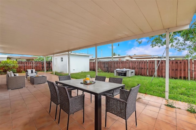 view of patio with an outdoor structure, a fenced backyard, a shed, outdoor lounge area, and outdoor dining space
