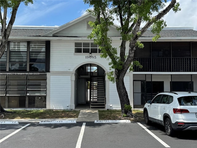 view of property with uncovered parking