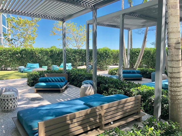 view of patio featuring an outdoor hangout area and a pergola