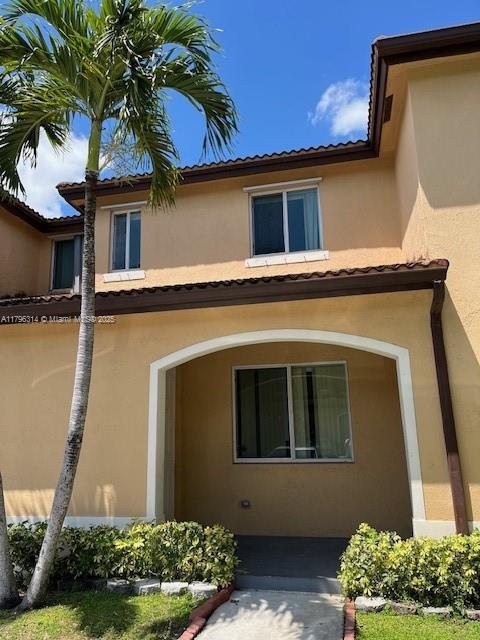 12080 SW 268th St Unit 28, Homestead, FL 33032 - exterior space featuring stucco siding and a tiled roof