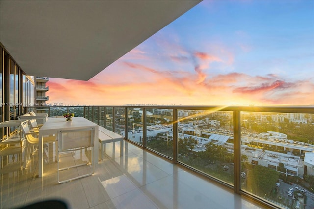 balcony at dusk with a view of city