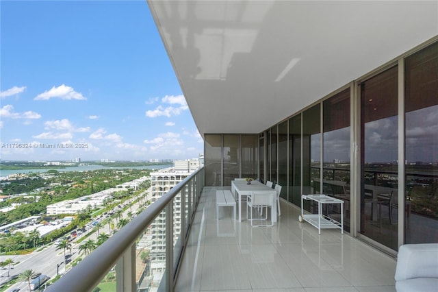 balcony with a water view and a city view