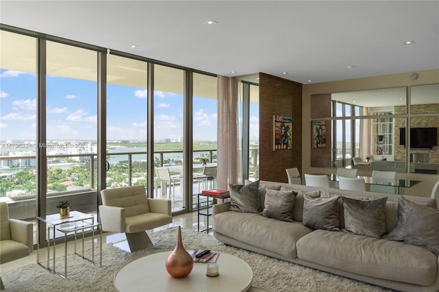 living area featuring floor to ceiling windows