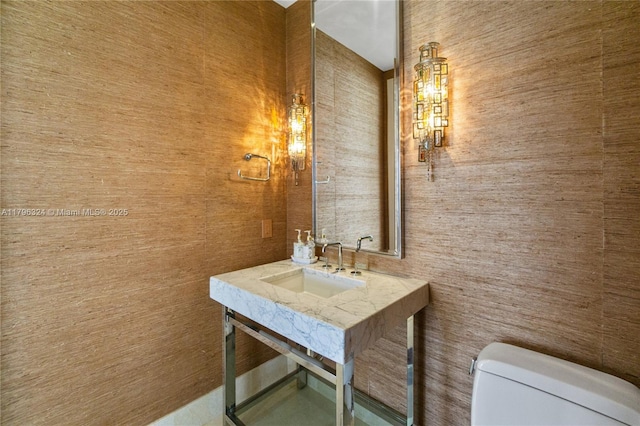 bathroom with a sink and toilet