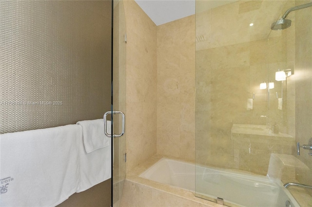 bathroom with a bathing tub and a shower with shower door