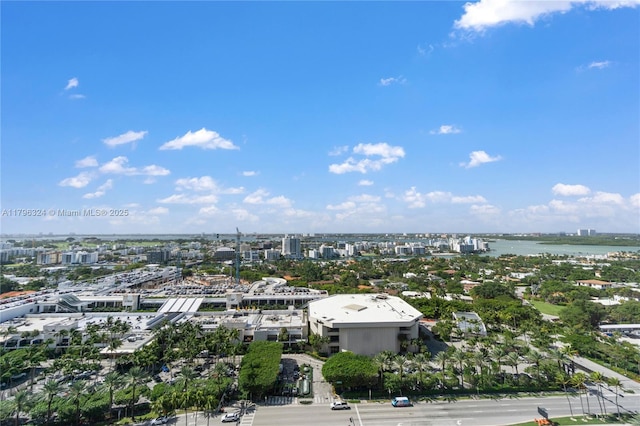 birds eye view of property with a view of city and a water view
