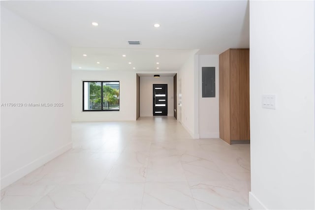 corridor with electric panel, visible vents, baseboards, marble finish floor, and recessed lighting