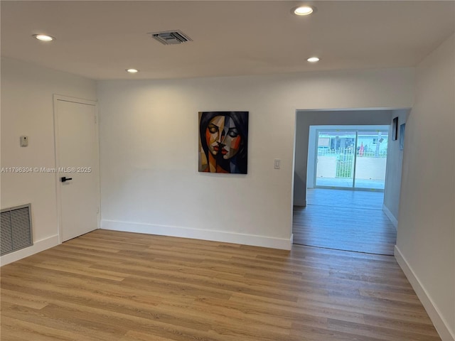 unfurnished room with visible vents, recessed lighting, and light wood-style flooring