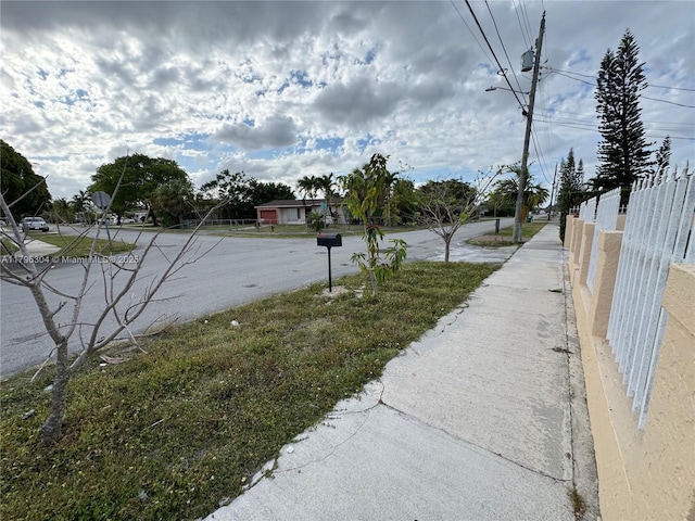 view of road with street lights and sidewalks
