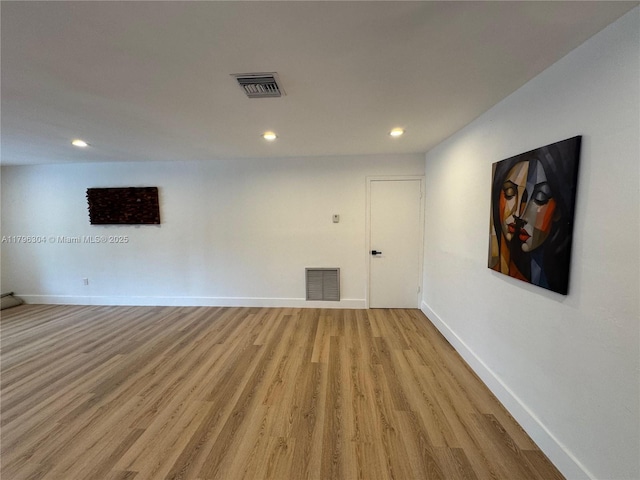 unfurnished room with visible vents, recessed lighting, light wood finished floors, and baseboards