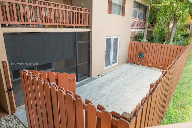 view of patio featuring fence