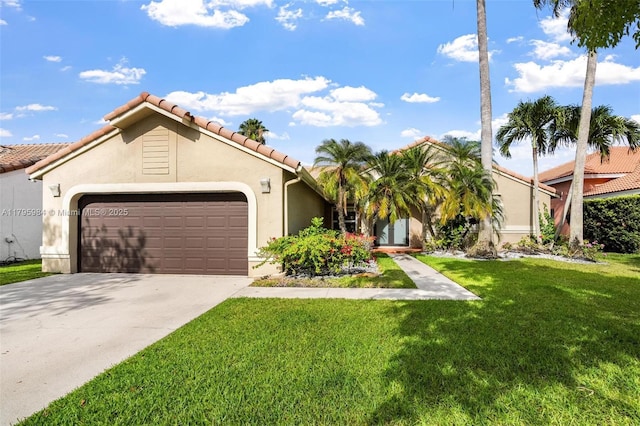 mediterranean / spanish home featuring an attached garage, stucco siding, a tile roof, concrete driveway, and a front yard