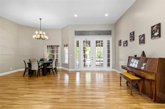 dining area featuring a chandelier, recessed lighting, baseboards, and light wood-style floors