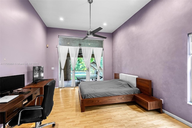 bedroom featuring light wood finished floors, ceiling fan, and access to exterior