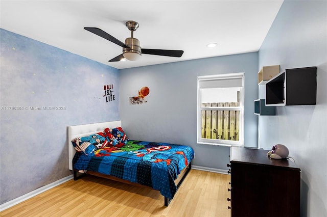 bedroom featuring ceiling fan, recessed lighting, baseboards, and wood finished floors