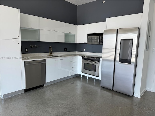 133 NE 2nd Ave Unit 1905, Miami, FL 33132 - kitchen featuring appliances with stainless steel finishes, white cabinetry, light countertops, and modern cabinets