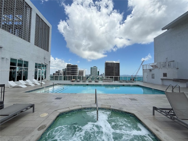 133 NE 2nd Ave Unit 1905, Miami, FL 33132 - community pool with a hot tub and a patio area