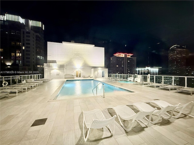 133 NE 2nd Ave Unit 1905, Miami, FL 33132 - pool at twilight featuring a community pool and a patio area