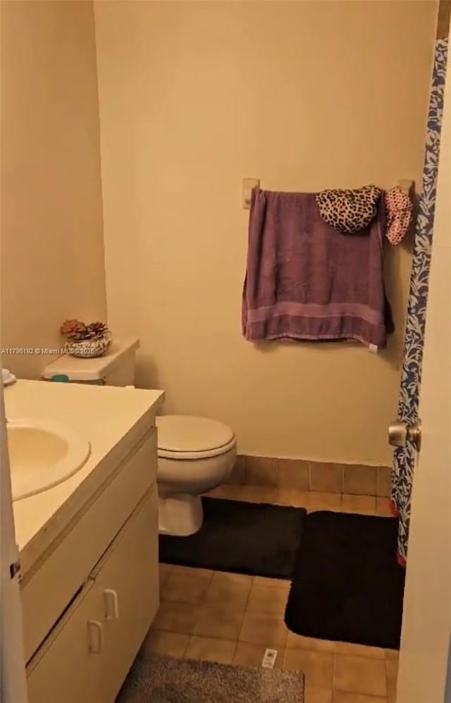 full bath with vanity, tile patterned floors, and toilet