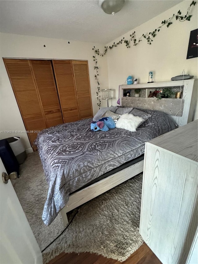 bedroom featuring wood finished floors and a closet