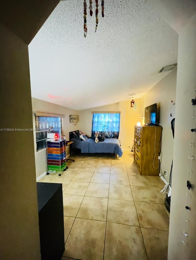 5706 Simms St, Hollywood, FL 33021 - living room with tile patterned flooring, lofted ceiling, and a textured ceiling