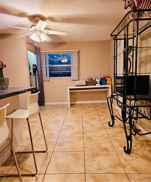 5706 Simms St, Hollywood, FL 33021 - dining space with a textured ceiling, tile patterned flooring, and a ceiling fan