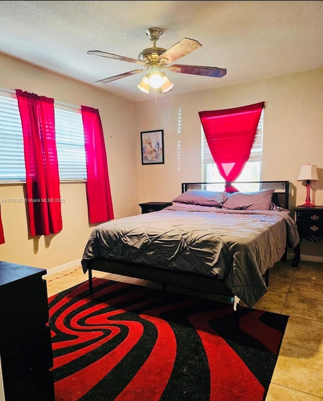 5706 Simms St, Hollywood, FL 33021 - bedroom featuring a textured ceiling, tile patterned flooring, and a ceiling fan