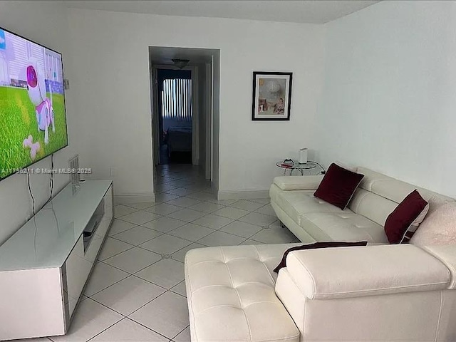 6620 W 2nd Ct Unit 407, Hialeah, FL 33012 - living area with light tile patterned flooring and baseboards