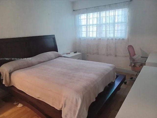 6620 W 2nd Ct Unit 407, Hialeah, FL 33012 - bedroom with wood finished floors