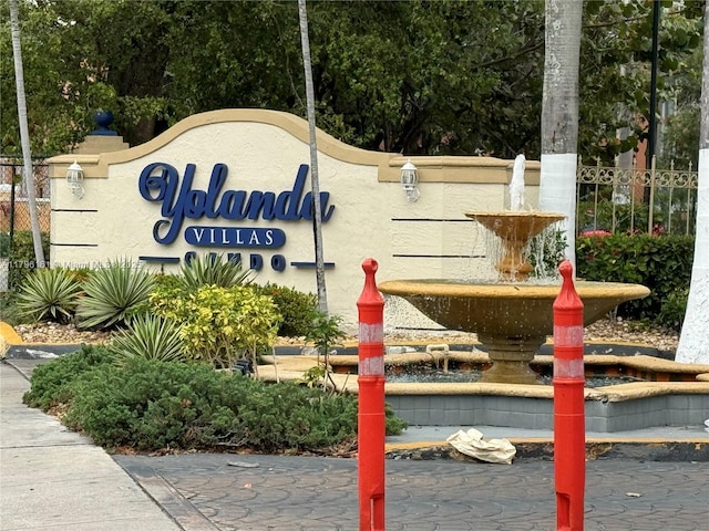 community sign with fence