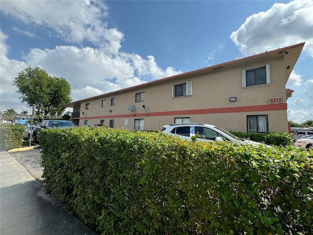6215 W 22nd Ct Unit 15, Hialeah, FL 33016 - view of property exterior featuring stucco siding