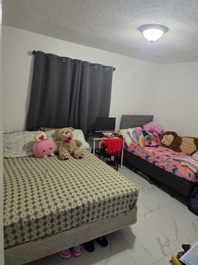 6215 W 22nd Ct Unit 15, Hialeah, FL 33016 - bedroom with a textured ceiling and marble finish floors
