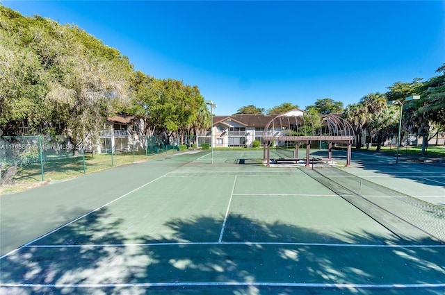 view of sport court with fence