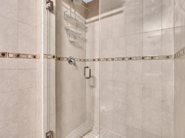 full bath with a shower stall