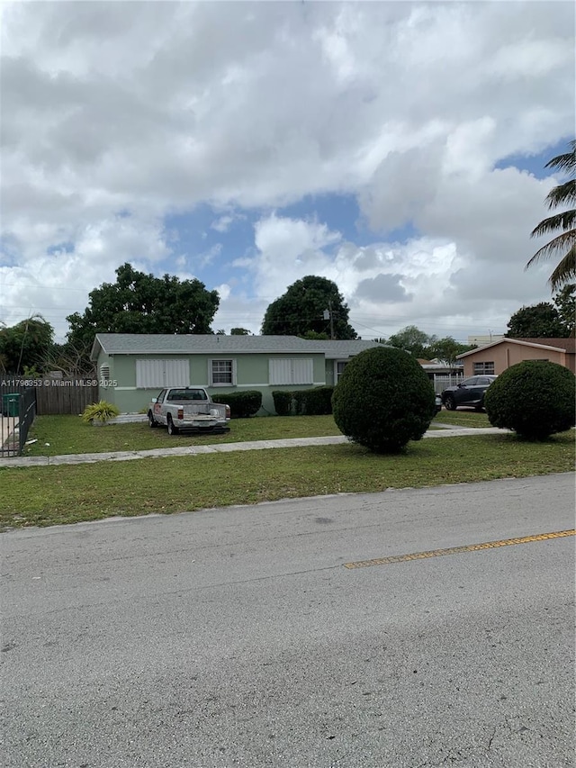 17200 N Miami Ave, Miami, FL 33169 - manufactured / mobile home featuring a front lawn and fence