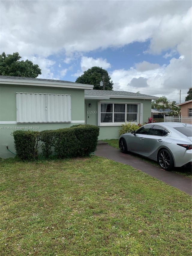 17200 N Miami Ave, Miami, FL 33169 - view of front of home featuring a front lawn and stucco siding