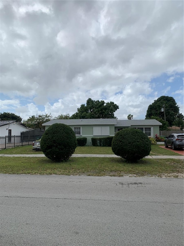 17200 N Miami Ave, Miami, FL 33169 - ranch-style house with a front lawn and fence