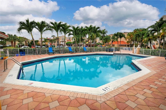 community pool featuring fence