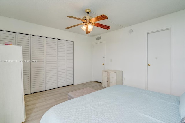 2350 NE 135th St Unit 510, North Miami, FL 33181 - bedroom with wood finished floors, a ceiling fan, and a closet